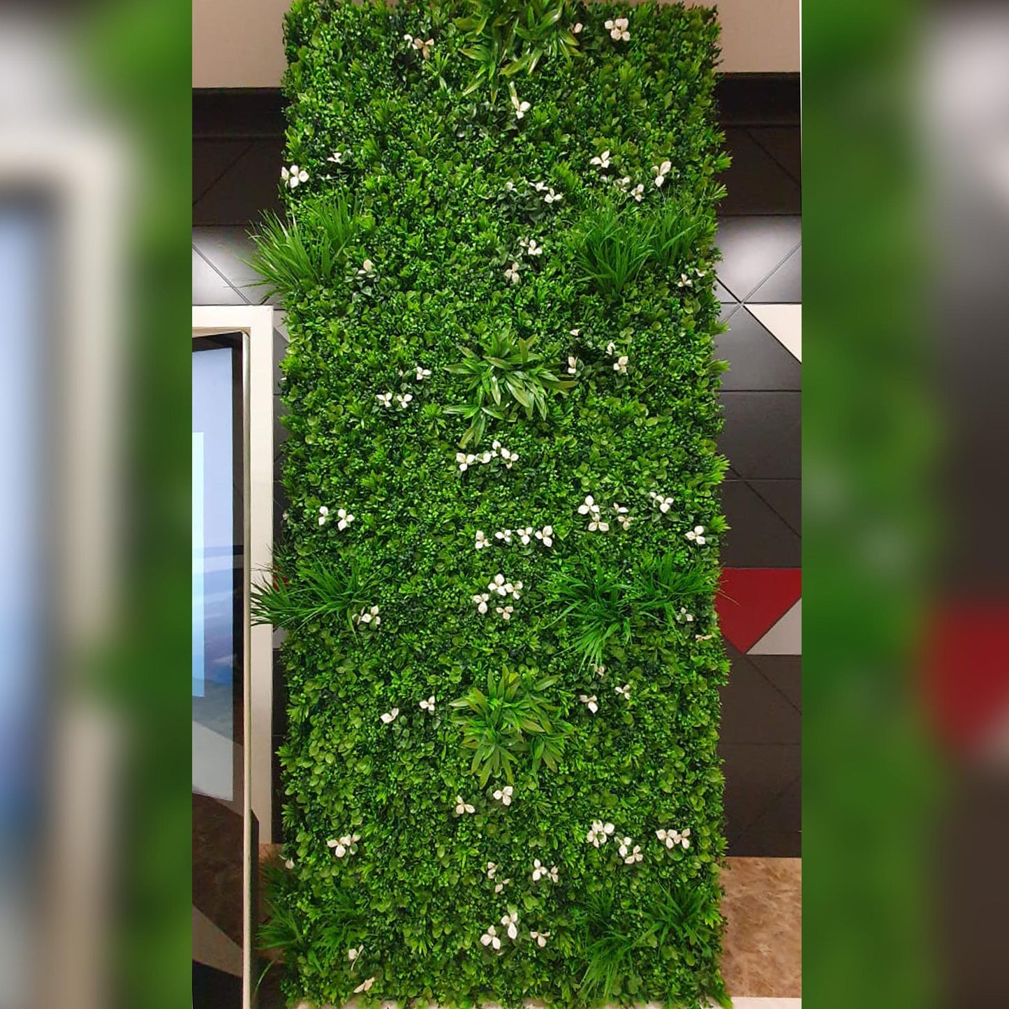 Artificial green wall in Dubai office space.